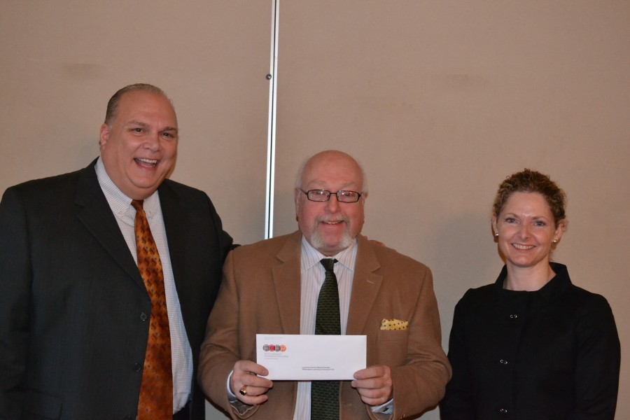 Executive Director Gark Parks with Frank Pellegrino, vice chair of First Community Foundation Partnership, and Trisha Marty, chair of Williamsport Lycoming Regional Advisory Board as well as a member of FCFP