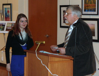 Lycoming County Historical Society President John Raymond presents award to Anna Lee Hafer.